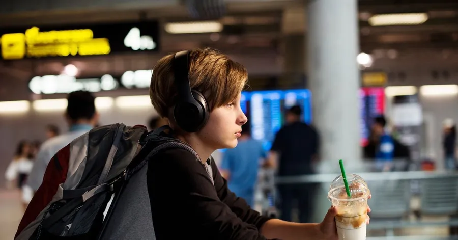 A 10-year-old boy alone at the airport. His parents flew off on vacation by themselves because he didn't have the necessary documents